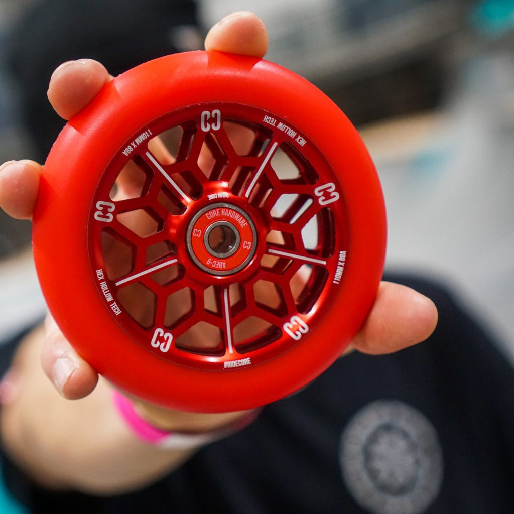Core-Hex-Hollow-Stunt-Scooter-Wheel-110mm-Red-In-Hand-Close-Up