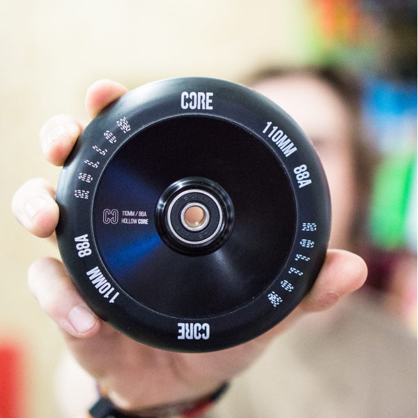 Core-Hollow-Stunt-Scooter-Wheel-V2-110mm-Black-Held-In-Hand